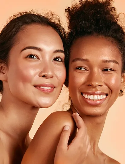 Two women with radiant, glowing skin