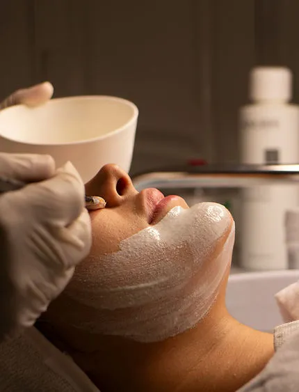 A client receiving a facial treatment